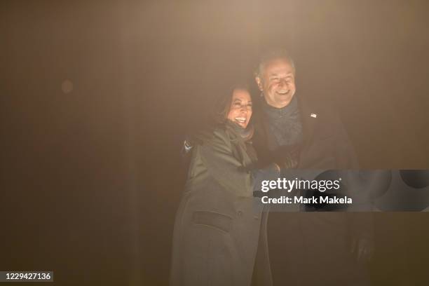 Democratic vice presidential nominee Sen. Kamala Harris and husband, Douglas Emhoff, take the stage after Democratic presidential nominee Joe Biden...