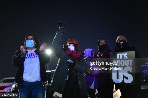 Supporters listen as Democratic vice presidential nominee Sen. Kamala Harris speaks at a drive-in election eve rally on November 2, 2020 in...