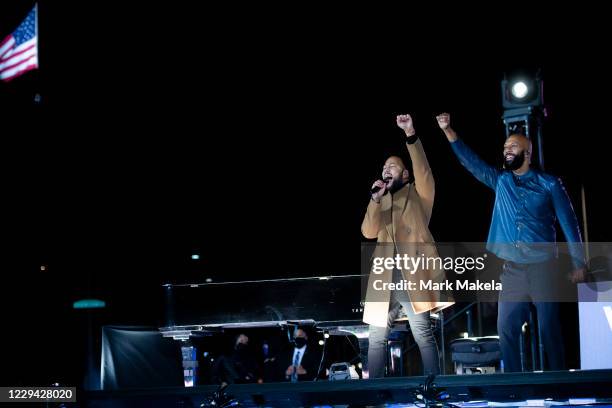 Singers John Legend and Common perform before Democratic vice presidential nominee Sen. Kamala Harris speaks at a drive-in election eve rally on...