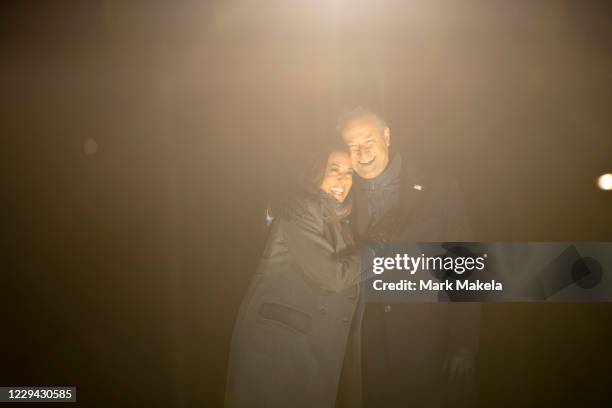 Democratic vice presidential nominee Sen. Kamala Harris and husband, Douglas Emhoff, embrace on stage after Democratic presidential nominee Joe Biden...