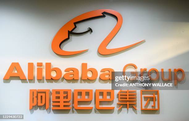 This photo taken on October 30, 2020 shows the logo of the Alibaba Group outside the offices of the Ant Group, the financial arm of the Chinese...