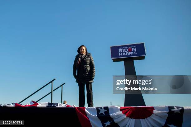 Democratic Vice Presidential Nominee Sen. Kamala Harris acknowledges the crowd while arriving at a drive-in rally on the eve of the general election...