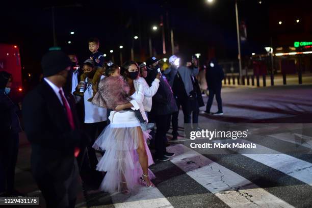 Model Chrissy Teigen, wife of singer John Legend, waits before taking the stage before Democratic vice presidential nominee Sen. Kamala Harris speaks...