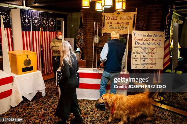 Voters gather at the Hale House at the historic Balsams Resort during midnight voting as part of the first ballots cast in the United States...