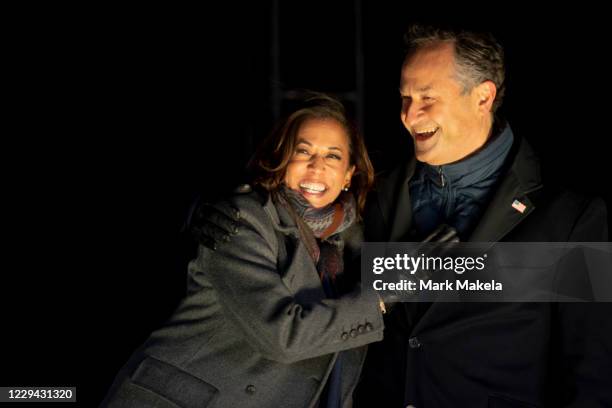 Democratic vice presidential nominee Sen. Kamala Harris and husband, Douglas Emhoff, embrace on stage after Democratic presidential nominee Joe Biden...