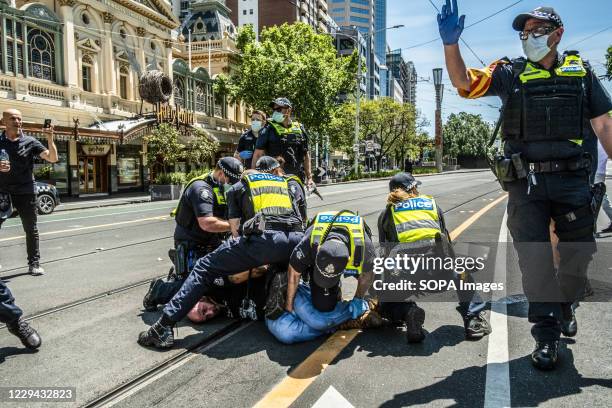 Member of the nazi group "Proud Boys" is being arrested by the Victoria Police during the demonstration at the Parliament House. Violence erupted at...