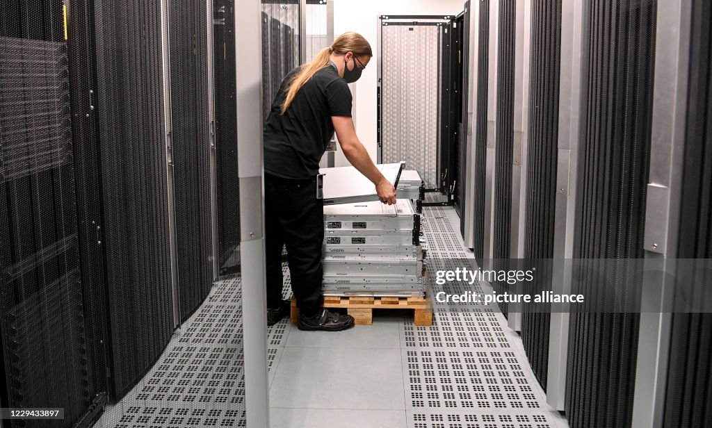 System administrator Alexander Landmann carries a server in the... News ...