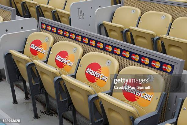 Front row seats seats are marked with corporate logos at the Los Angeles Dodgers game against the Arizona Diamondbacks on July 31, 2011 at Dodger...