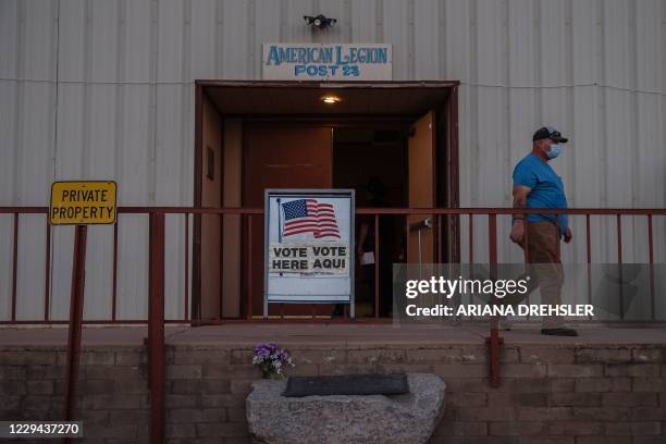 Man walks out after casting his vote at the American Legion in Tombstone, Arizona on November 3, 2020. - The United States started voting Tuesday in...