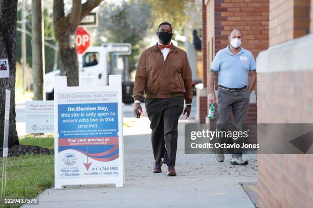 Voters enter the West Tampa Public Library polling precinct to cast their ballots on November 3, 2020 in Tampa, Florida. After a record-breaking...