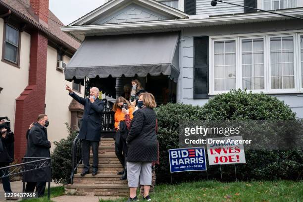 Democratic presidential nominee Joe Biden waves to onlookers from the steps of his childhood home on November 03, 2020 in Scranton, Pennsylvania. As...