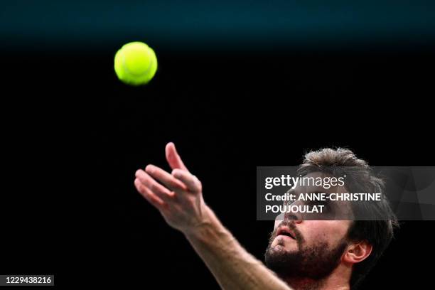 France's Gilles Simon serves the ball to Tommy Paul of the US during their men's singles first round tennis match on day 2 at the ATP World Tour...