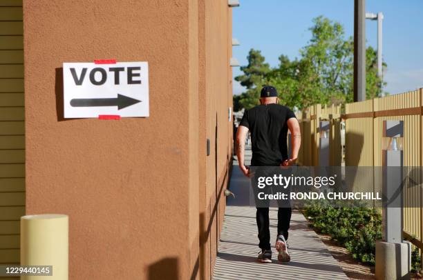 Man exits a polling station at Dupak Community Center on election day on November 3 in Las Vegas, Nevada. - Americans were voting on Tuesday under...