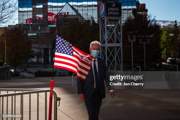 Louisville Mayor Greg Fischer walks toward the polling area in the KFC YUM! Center on November 3, 2020 in Louisville, Kentucky. After a...