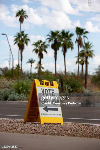 Vote here" sign directs voters outside Marquee Theatre on November 3, 2020 in Tempe, Arizona. After a record-breaking early voting turnout, Americans...