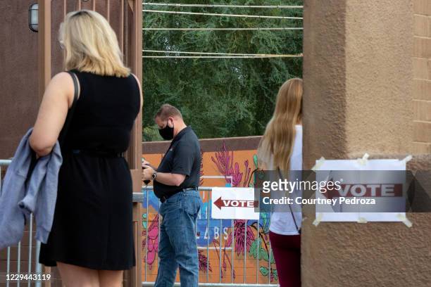 Voters wait to cast their ballots at Marquee Theatre on November 3, 2020 in Tempe, Arizona. After a record-breaking early voting turnout, Americans...