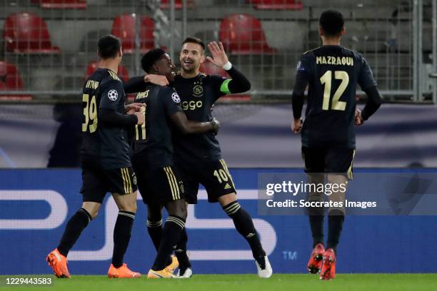 Dusan Tadic of Ajax Celebrates 0-2 with Quincy Promes of Ajax during the UEFA Champions League match between FC Midtjylland v Ajax at the MCH Arena...