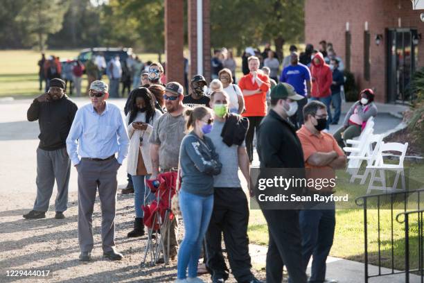 Voters wait in line to cast ballots at Savannah Grove Baptist Church on November 3, 2020 in Effingham, South Carolina. After a record-breaking early...