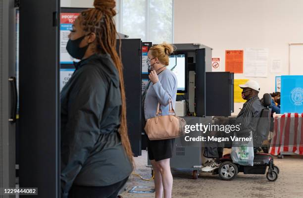 Voters cast their ballots at The Metropolitan Library on November 3, 2020 in Atlanta, Georgia. After a record-breaking early voting turnout,...