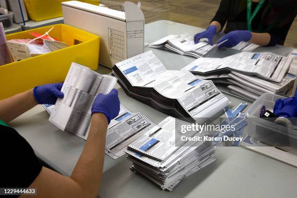 King County Elections workers process ballots at King County Elections headquarters on November 3, 2020 in Renton, Washington. Washington state is on...