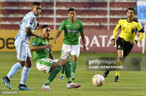 Bolivia's Bolivar Cristhian Machado and Chile's Audax Italiano Jorge Henriquez vie for the ball during their closed-door Copa Sudamericana second...