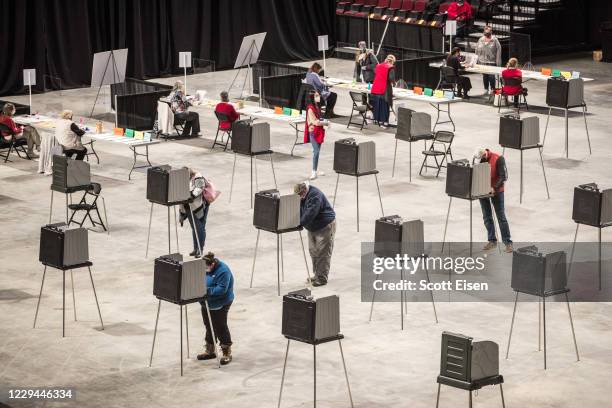 Voters fill out and cast their ballots at the Cross Insurance Center polling location where the entire city votes on November 3, 2020 in Bangor,...