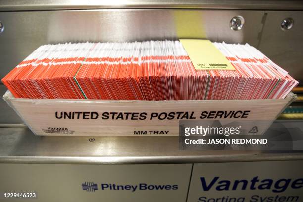 Box of ballots to be sorted are pictured in a US Postal Service box on Election Day at the King County Elections office in Renton, Washington on...