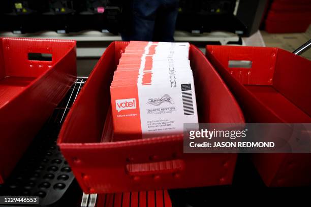 Sorted vote-by-mail ballots are pictured on Election Day at the King County Elections office in Renton, Washington on November 3, 2020. - Americans...