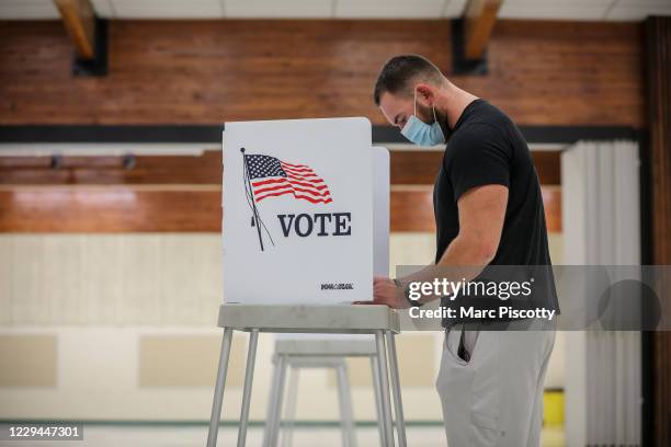 First time voter Daylon Stutz votes at the Jefferson County Fairgrounds on November 3, 2020 in Golden, Colorado. After a record-breaking early voting...