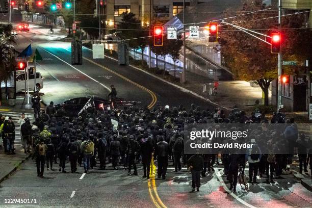 Racial justice protesters march from the Capitol Hill neighborhood toward downtown on November 3, 2020 in Seattle, Washington. Police say they made...