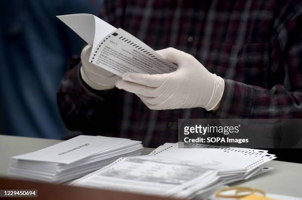 County employee opens mail-in ballots at the Luzerne County Bureau of Elections. As the polling stations in Pennsylvania state close, the ballots for...