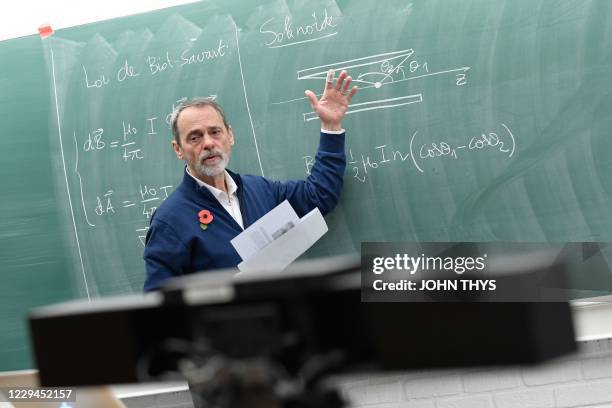 Professor Jan Govaerts at The School of Physics at UCLouvain gestures as he teaches alone in a small lecture theatre of the university at...