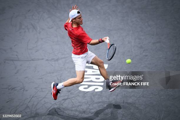 Argentina's Diego Schwartzman returns the ball to France's Richard Gasquet during their men's singles second round tennis match on day 3 at the ATP...