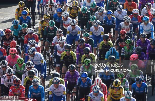 The pack rides in Lugo during the 14th stage of the 2020 La Vuelta cycling tour of Spain, a 204.7-km race from Lugo to Ourense, on November 4, 2020.