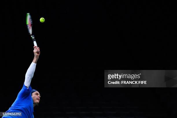 Canada's Milos Raonic serves the ball to France's Pierre-Hugues Herbert during their men's singles second round tennis match on day 3 at the ATP...