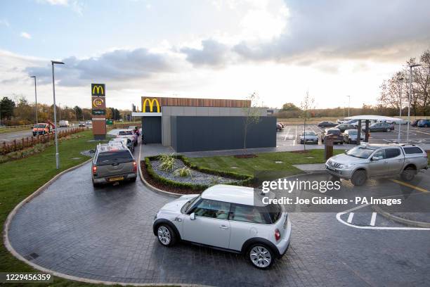 Cars queue at the drive thru of a new McDonald's restaurant, based on the outskirts of Oakham, which has opened as Rutland becomes the last county in...