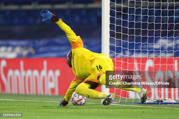Rennes goalkeeper Alfred Gomis fails to save the penalty kick from Timo Werner of Chelsea which leads to the opening goal during the UEFA Champions...