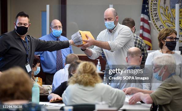 Luzerne County employees open mail-in ballots to be counted Luzerne County employees open mail-in ballots to be counted