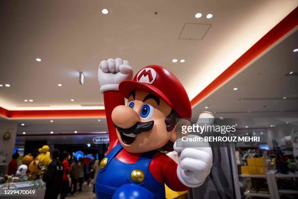 Doll of Nintendo game character Mario is displayed at a Nintendo store in Tokyo on November 5 after the gaming giant said its first-half net profit...