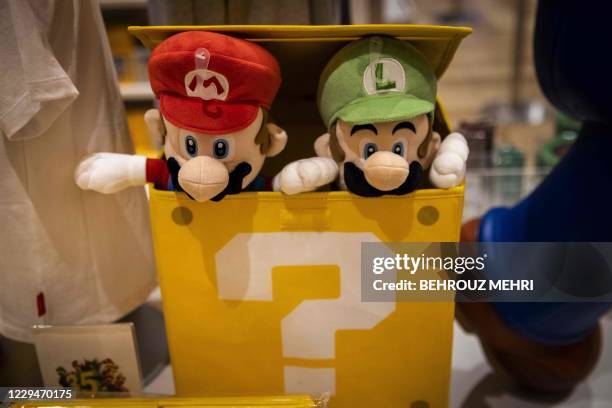 Dolls of Nintendo game characters Mario and Luigi are displayed at a Nintendo store in Tokyo on November 5 after the gaming giant said its first-half...