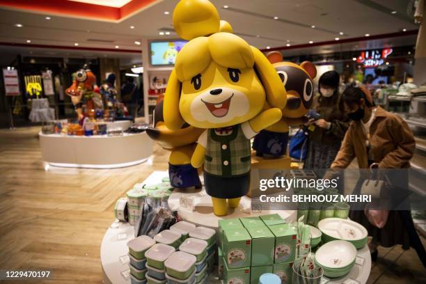 Doll of Nintendo Animal Crossing game character Isabelle, known as Shizue in Japan, is displayed at a Nintendo store in Tokyo on November 5 after the...