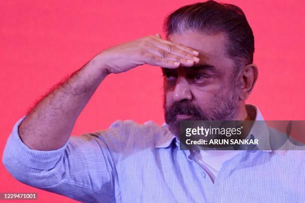 Indian actor turned politician Kamal Haasan, founder of Makkal Needhi Maiam , a regional political party, watches during a media briefing in Chennai...