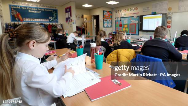 Year 4 pupils at Manor Park School and Nursery in Knutsford, Cheshire, take part in a maths lesson, at the start of a four week national lockdown for...