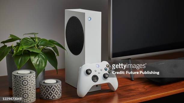 Living room with a Microsoft Xbox Series S home video game console alongside a television and soundbar, taken on October 27, 2020.