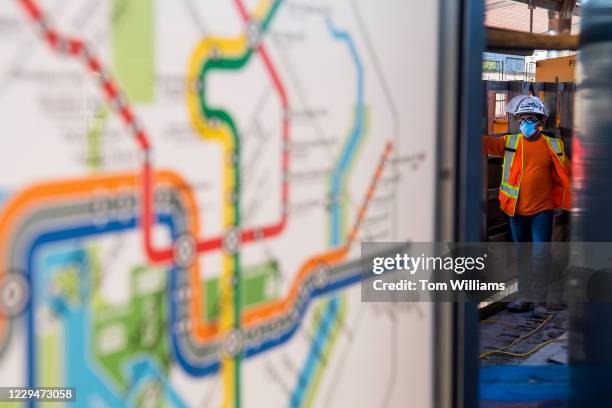 Worker is seen during the platform reconstruction project at Reagan National Airport Metro Station in Arlington, Va., on Wednesday, November 4, 2020.