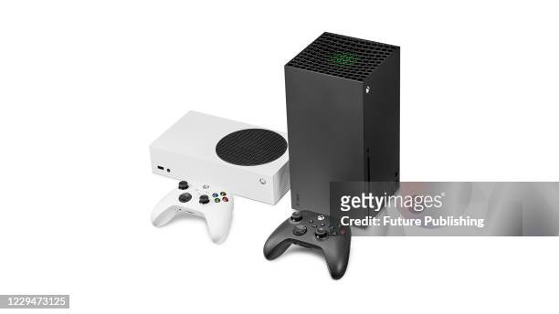 Pair of Microsoft home video game consoles, including an Xbox Series S and Xbox Series X, taken on October 27, 2020.