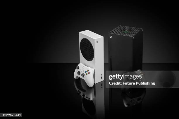 Pair of Microsoft home video game consoles, including an Xbox Series S and Xbox Series X, taken on October 27, 2020.