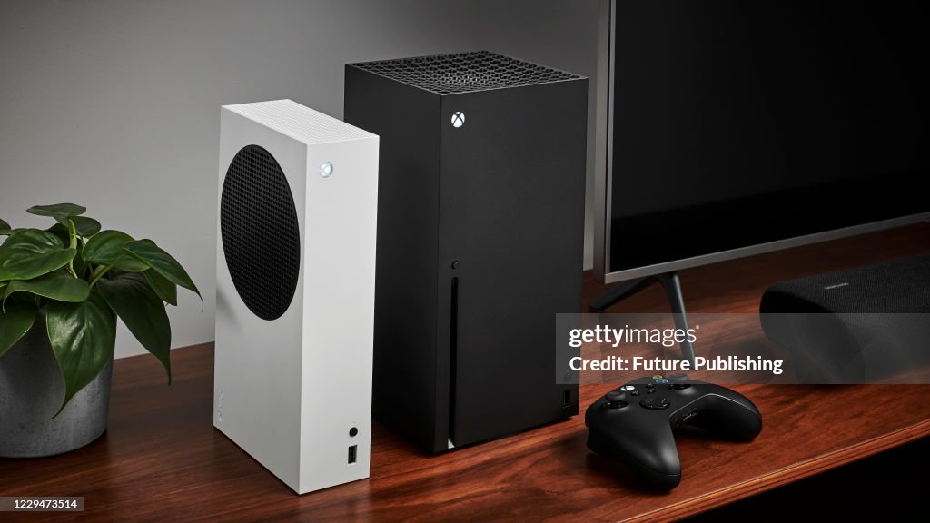 Gamer Using Xbox Living room with a pair of Microsoft home video game consoles,... News ...