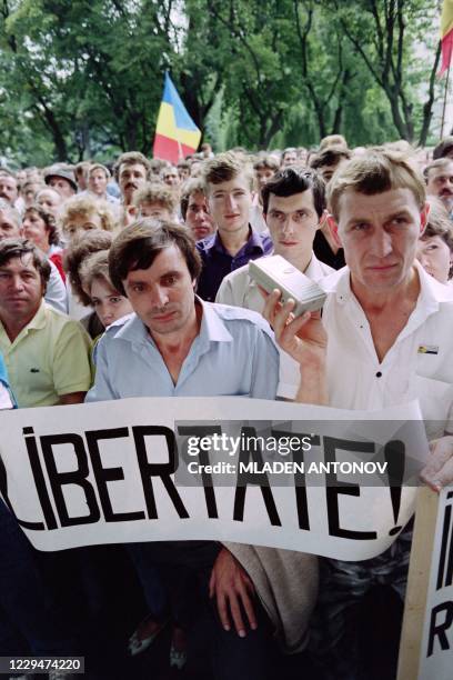 Moldavian hold a banner saying "Libertate" during a demonstration after the parliament declared its independence on August 27, 1991 in Kishinev.