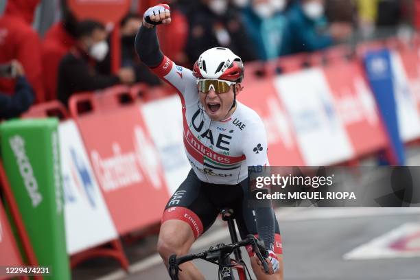 Emirates Team's Belgian rider Jasper Philipsen celebrates as he crosses the finish-line of the 15th stage of the 2020 La Vuelta cycling tour of...